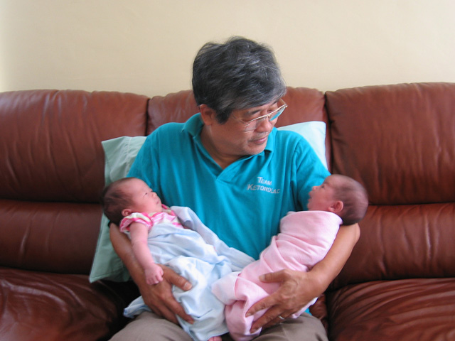 Grandfather Holding Both Girls