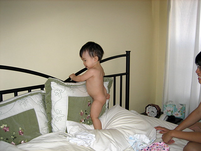 Miranda Climbing on the Bed