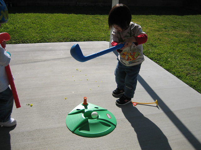 Eleanor Swinging a Golf Club