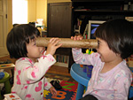 Both of the Them Playing with the Paper Roll