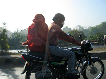 a couple on a motorcycle